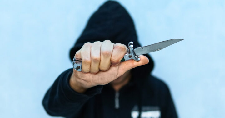 young-man-hoodie-holding-knife-symbolizing-youth-crime-crime-concept-threat-cold-weapon-terrorist-from-isis-with-knife-prisoner-with-shiv